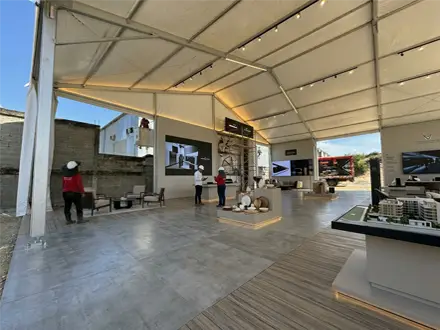 diseño showroom de exhibición tipo hangar